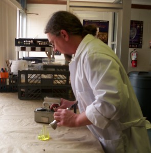 Joe Blondino using Geiger counter on Vaseline glass.